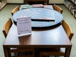 Indoors, Jigsaw Puzzle Table With Puzzle Started On Large Table With Multiple Chairs